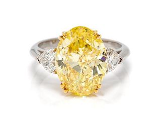A Platinum, 18 Karat Yellow Gold, Fancy Intense Yellow Diamond and Diamond Ring, 5.60 dwts.