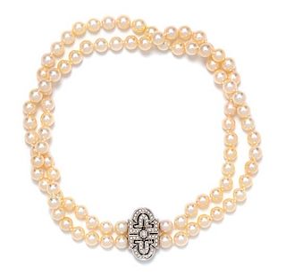 An 18 Karat White Gold, Double Strand Cultured Pearl and Diamond Necklace, Italian, 55.10 dwts.
