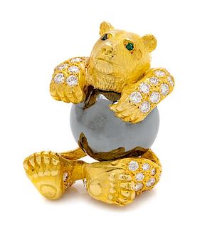 A Yellow Gold, Hematite, Diamond and Emerald Bear Brooch, 23.60 dwts.