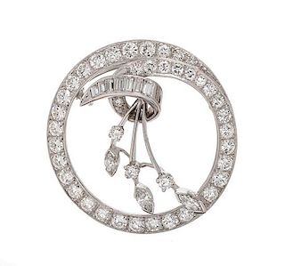 A Platinum and Diamond Circle Pendant/Brooch, 6.90 dwts.