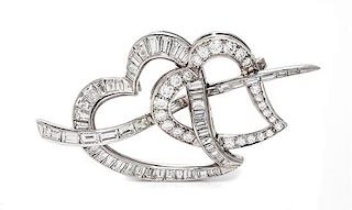 A Platinum and Diamond Double Heart Brooch, 8.40 dwts.