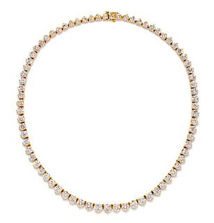 An 18 Karat Yellow Gold and Diamond Riviere Necklace, 18.50 dwts.