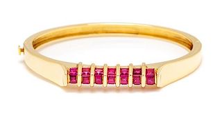 An 18 Karat Yellow Gold and Ruby Bangle Bracelet, Montreaux, 20.80 dwts.