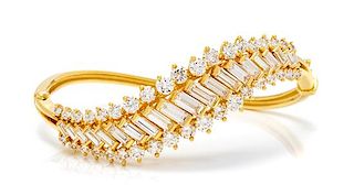 An 18 Karat Yellow Gold and Diamond Bangle Bracelet, Kurt Wayne, 22.00 dwts.