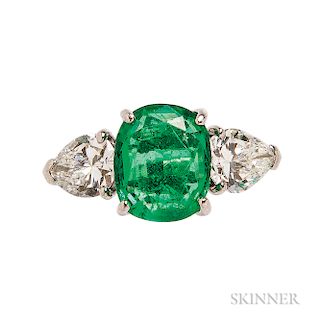 Platinum, Emerald, and Diamond Ring, prong-set with an oval cushion-cut emerald measuring approx. 10.50 x 8.60 x 4.30 mm, and pear-shap