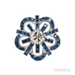 Platinum, Diamond, and Sapphire Clip/Brooch, Cartier, Paris, c. 1960, set with a full-cut diamond weighing approx. 1.50 cts., and calib