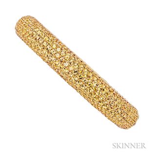 18kt Gold and Fancy Color Sapphire Bracelet, the hinged bangle set with circular-cut orangy-yellow sapphires, 35.7 dwt, interior cir. 6
