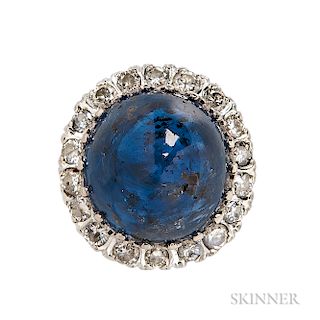 White Gold, Sapphire, and Diamond Ring, set with a large, high-domed cabochon measuring approx. 16.40 x 15.50 x 12.70 mm, framed by ful