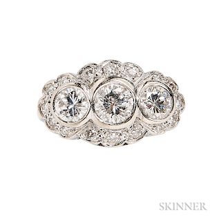 18kt White Gold and Diamond Ring, bezel-set with three full-cut diamonds weighing approx. 0.75, 0.50, and 0.50 cts., framed by full-cut