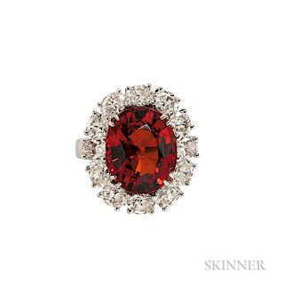 Platinum, Garnet, and Diamond Ring, the large garnet measuring approx. 13.80 x 11.30 x 7.20 mm, framed by oval-cut diamonds, approx. to