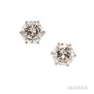 14kt White Gold and Diamond Earstuds, set with full-cut diamonds weighing 1.01 and 1.03 cts.