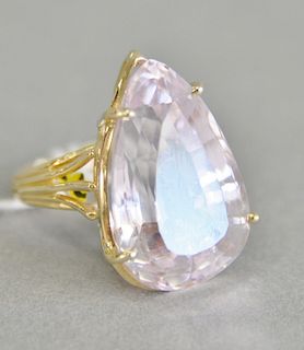 14 karat gold ring, set with pear shaped topaz, light pink color. 
size 6 with horseshoe ring guard, 11.4 grams total weight