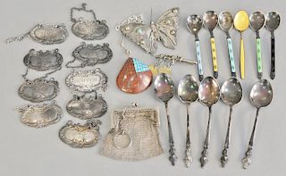 Sterling silver lot with nine liquor bottle tags, six enameled handled spoons, figural spoon, etc.