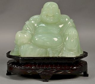 Large carved jade or jadeite figure of a seated buddha. figure: ht. 7 1/4in., lg. 10 1/2in., wd. 11 1/2 in.