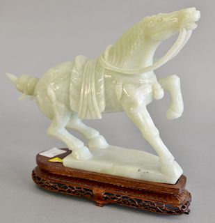 Light green jade carved horse on wood base. total ht. 10 3/4 in., wd. 11 1/2 in.