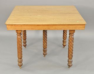 Square oak table with turned legs and two leaves (one 7 in. and one 10 in.). ht. 30 in., top closed: 42" x 42", top open: 42" x 59"