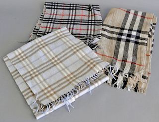Three Burberry scarves or shawls, two are marked cashmere.