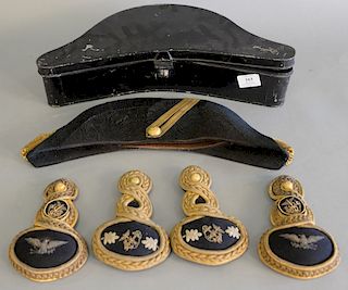 Military ornamental set to include two pairs of epaulette (lg. 7 in.) and dress hat in tole case (lg. 17 1/2 in.).