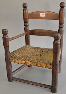 Primitive ladder back child's armchair with rush seat in original finish, late 17th to early 18th century. ht. 21 1/2 in., seat ht. ...