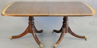 Custom mahogany double pedestal dining table with two 22 inch leaves. ht. 28 1/2 in., top: 45" x 67" opens to 111 in.