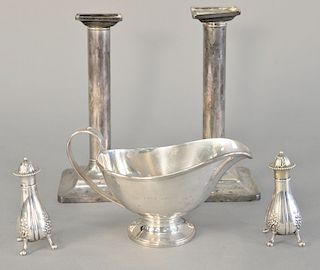 Five piece Tiffany & Co. lot to include sterling silver gravy boat monogrammed, pair of Tiffany & Co. candlesticks weighted, and a p...
