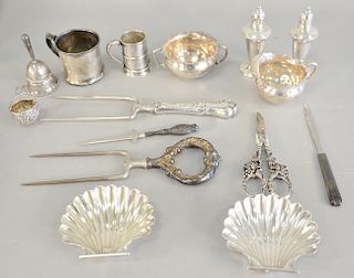 Sterling silver lot with mugs, shell dishes, sugar, creamer, and weighted pieces. 12.6 troy ounces plus weighted pieces and bell.