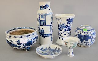 Group of six pieces of Chinese porcelain to include two blue and white sleeve form vases, blue and white jar, footed blue and white ...