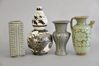 Four Chinese vases to include black and white double gourd vase with dragon, green glazed urn with handle, green glazed square vase,...