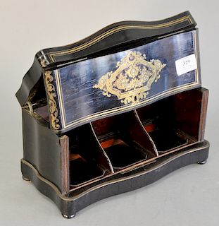 French rosewood tantalus having brass boulle and mother of pearl inlaid panels, opening to two fitted spaces for bottles. 
Provenanc...