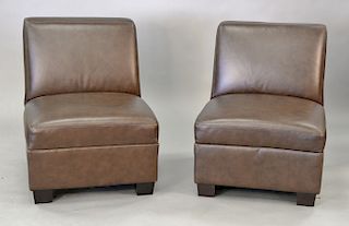 Pair of leather armless slipper chairs. ht. 32 in., wd. 27 in.