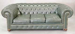 Chesterfields of London, green leather Chesterfield sofa. ht. 28 in., wd. 83 in.