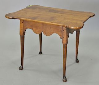 Queen Anne tea table having shaped top, circa 1750. ht. 25 1/4 in., top: 24 1/2" x 33 3/4"