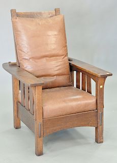 Two piece lot to include Mission Oak Morris chair with leather cushions (ht. 41 in.) and Mission stool with leather top.