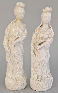 Two standing Geisha or Guanyin figures, white glazed and blanc de chine (one with repaired neck). ht. 10 in., 10 1/4 in.