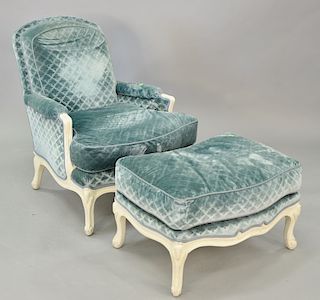 Louis XV style bergere and ottoman with custom upholstery. 
Provenance: Estate from Park Avenue, New York