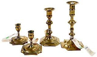 Four Early Georgian Brass Candlesticks