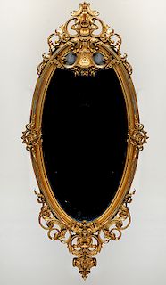 OVAL MIRROR WITH GILTWOOD ROCOCO STYLE FRAME