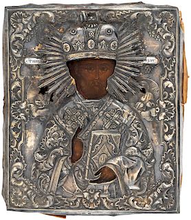 A RUSSIAN ICON OF ST. NICHOLAS THE WONDERWORKER WITH SILVER AND CHAMPLEVE ENAMEL OKLAD, MOSCOW, 1844