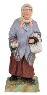 A RUSSIAN PORCELAIN FIGURE OF A JEWESS, GARDNER PORCELAIN FACTORY, MOSCOW, LATE 19TH CENTURY