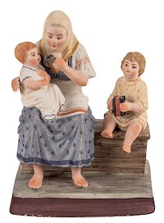 A RUSSIAN PORCELAIN FIGURE OF A PEASANT WOMAN WITH TWO CHILDREN, GARDNER PORCELAIN FACTORY, MOSCOW, LATE 19TH CENTURY