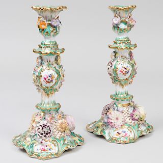 Pair of English Porcelain Flower Encrusted Green Ground Candlesticks