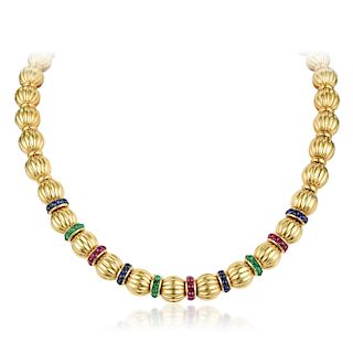 A Multi-Colored Gemstone and Fluted Gold Bead Necklace