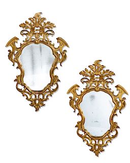 A pair of Rococo style carved giltwood mirrors