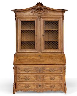 A Louis XV style oak secretaire bookcase
