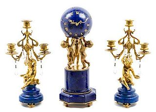 A French Gilt Bronze and Lapis Lazuli Clock Garniture Height of clock 16 inches.