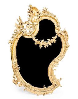 * A Rococo Style Giltwood Mirror Height 51 1/2 x width 33 1/4 inches.