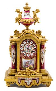 * A Louis XVI Sevres Style Porcelain Mounted Gilt Bronze Table Clock Height 17 inches.