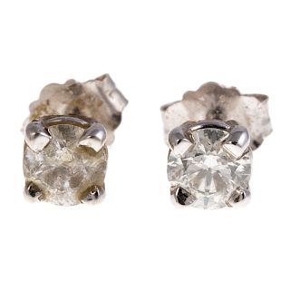 A Pair of Ladies Diamond Solitaire Earrings in 14K