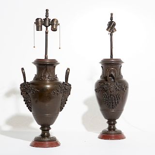 A pair of French bronze and marble urns