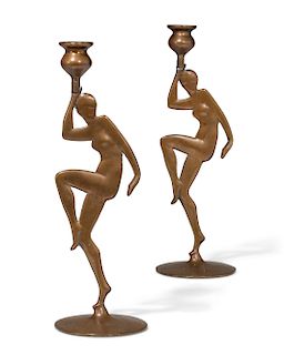 A pair of Art Deco figural bronze candlesticks